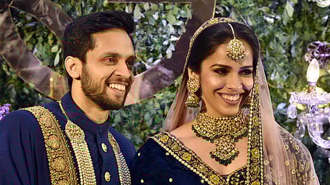 Saina Nehwal and Parupalli Kashyap during their wedding reception party in Hyderabad.