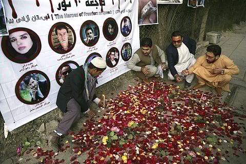 Afghan residents light candles to pay tribute to Afghan journalists killed three days earlier in a suicide attack in Kabul, Afghanistan. (Photo: AP)