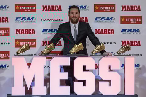 FC Barcelona's Lionel Messi from Argentina poses for the media after receiving his 5th Golden Boot award, in Barcelona, Spain, Tuesday, Dec.18, 2018. | AP