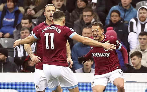 West Ham United's Javier Hernandez (R) celebrates scoring his side's first goal of the game with team-mates during the English Premier League match against Newcastle United at St James Park stadium (Photo | AP)