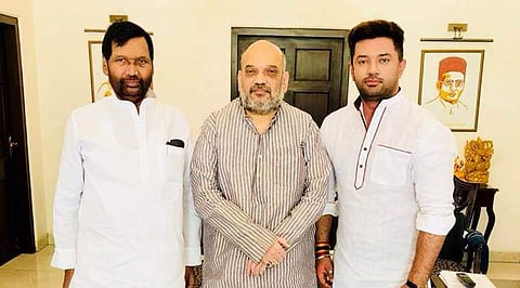 LJP chief Ram Vilas Paswan (L) and son Chirag Paswan with BJP president Amit Shah. (Source: irvpaswan-Twitter/File)