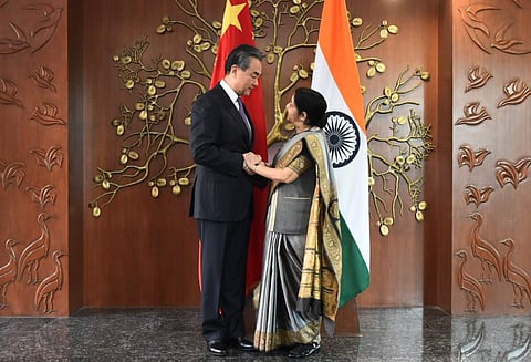 Sushma Swaraj welcomes Chinese State Councilor & Foreign Minister Wang Yi ahead of 1st meeting of India-China High Level Mechanism on Cultural & People-to-People Exchanges (Photo | Twitter)
