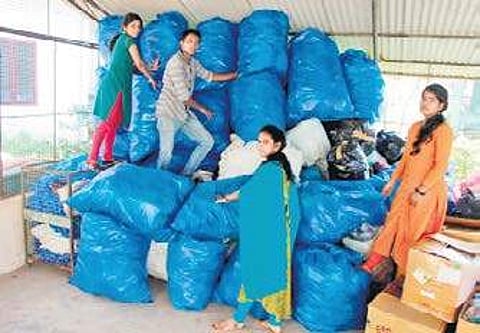 Students of Bharata Matha College with the collected water bottles