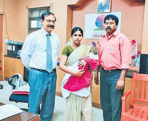 Dr A T Arasar Seeralar and Dr G K Jaikaran with S Jayanthi, mother of the four-month-old baby boy, who underwent the open-heart surgery. | Express Photo Services