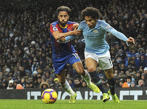 Crystal Palace's Andros Townsend, left, and Manchester City's Leroy Sane challenge for the ball during the English Premier League soccer match between Manchester City and Crystal Palace at Etihad stadium in Manchester. (Photo | AP)
