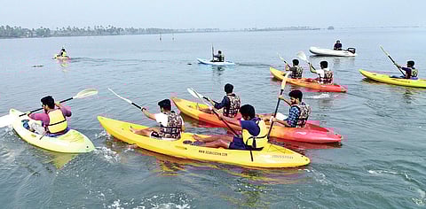 Kayaking peddlers demonstrating skills after the inauguration of the kayaking facility at Queens Walkway on Saturday. The facility is a joint initiative of DTPC and GIDA to promote water sports in Kochi | A Sanesh