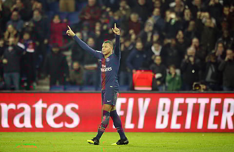 PSG forward Kylian Mbappe reacts after scoring his side first goal during the League One soccer match between Paris Saint Germain and Nantes at the Parc des Princes stadium in Paris, Saturday, Dec. 22, 2018. | AP