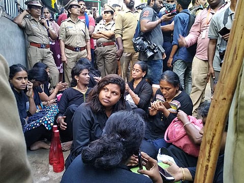 Women group at Pamba amid tight police security waiting to trek their way to the holy shrine. (Photo | Special Arrangement)