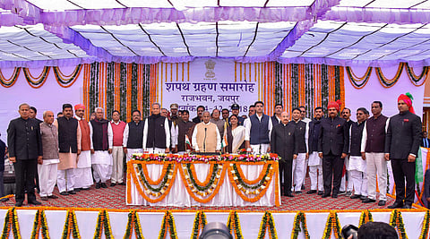 Rajasthan Governor Kalyan Singh, Chief Minister Ashok Gehlot and Deputy Chief Minister Sachin Pilot pose for a photograh with the newly sworn-in cabinet ministers during a ceremony at Raj Bhawan in Jaipur (Photo | PTI)