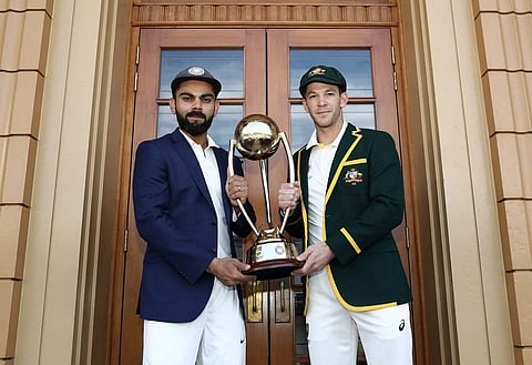 Indian cricket captain Virat Kohli and Australian captain Tim Paine with the Border-Gavaskar Trophy. (Photo | BCCI/ Twitter)