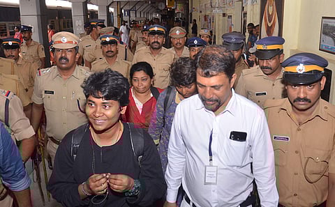 Manithi women activists returning to Thiruvananthapuram railway station with police protection on Monday after not being able to meet Kerala chief minister Pinarayi Vijayan. (Photo | BP Deepu/ EPS)