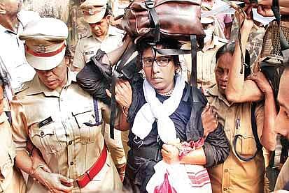 Police taking a middle-aged woman devotee back to Pampa after protest by Sabarimala pilgrims | Shaji Vettipu ram