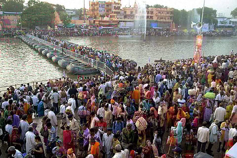 Devotees gather to take holy dip in River Kshipra during Simhastha Maha Kumbh Mela in Ujjain. (File| PTI)