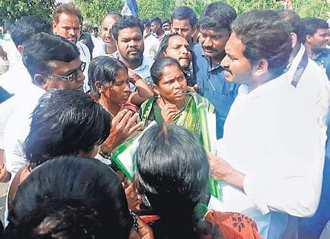 Fishermen’s kin with Jagan in Srikakulam district on Sunday | EXPRESS