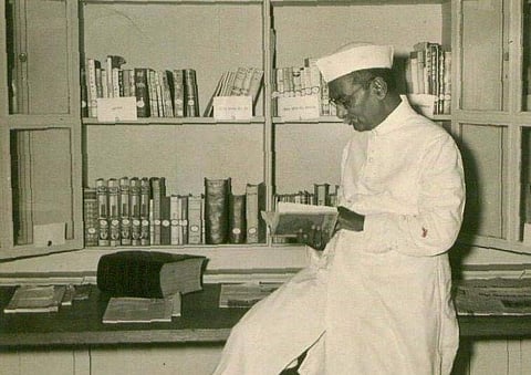 Dr Rajendra Prasad reading a book. (File | EPS)