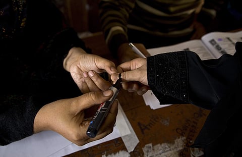 A woman casts her vote. (Photo | AP)