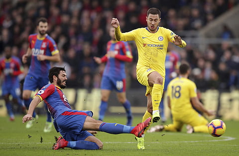 Chelsea's Eden Hazard is challenged by Crystal Palace's James Tomkins (Photo | AP)
