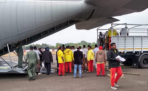 A team of Odisha Fire Services on board an Indian Air Force plane land in Guwahati Friday (Photo | PTI)
