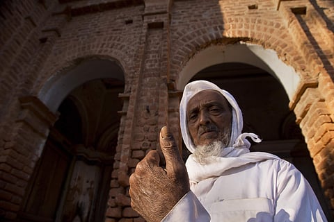 Abdul Malek Mia, 74, displays indelible ink mark on his thumb after casting his vote at a polling station in the ancient city of Panam Nagar, about 20 kilometers (12 miles) southeast of Dhaka, Bangladesh. (Photo | AP)
