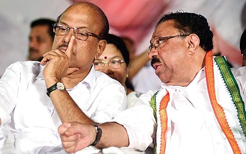 A file photo of KPCC president M M Hassan having a word with IUML leader P K Kunhalikutty.