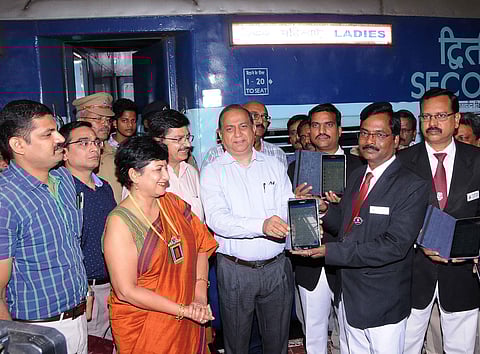 Southern railway general manager handing over the handheld terminal to the TTEs at Central station in Chennai on Monday. (Photo | EPS)