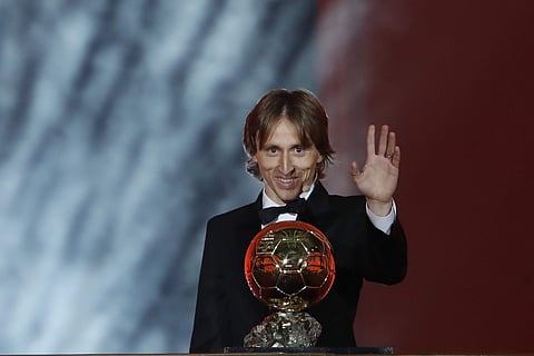 Real Madrid's Luka Modric celebrates with the Ballon d'Or award during the Golden Ball award ceremony at the Grand Palais in Paris on 3 December 2018. (Photo | AP)