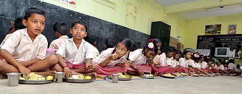 Representational image of students eating their mid-day meal.