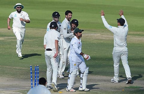New Zealand spinner Will Somerville (C) celebrates with teammates after taking the wicket of Pakistani captain Sarfraz Ahmed (2R) during the last day of the third and final Test cricket match between Pakistan and New Zealand. (Photo | AFP)