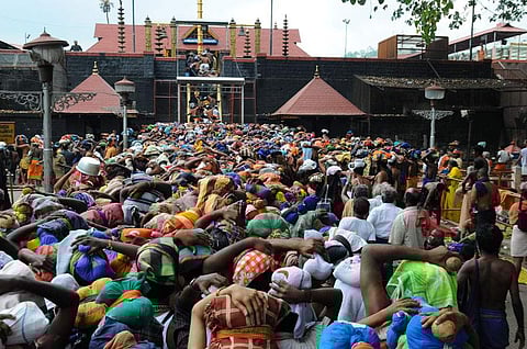 Pilgrims in front of the Sabarimala Lord Ayappa temple (Photo | EPS)