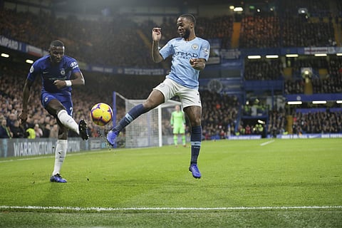 Chelsea's Antonio Rudiger, left, and Manchester City's Raheem Sterling compete for the ball during the English Premier League soccer match between Chelsea and Manchester City at Stamford Bridge in London, Saturday Dec. 8, 2018. | AP