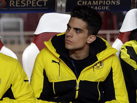 In this Wednesday April 19, 2017 file photo, Dortmund's Marc Bartra sits on the bench before their Champions League quarterfinal second leg soccer match against Monaco. | AP