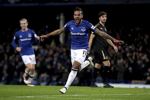 Everton's Theo Walcott celebrates scoring his side's first goal of the game during their English Premier League soccer match against Leicester City at Goodison Park. | AP