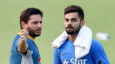 Former Pakistan skipper Shahid Afridi (L) and Indian captain Virat Kohli (File | PTI)