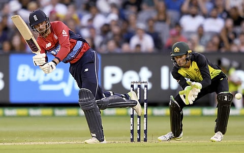 England's James Vince, left, pulls the ball in front of Australia's Alex Carey during their Twenty20 cricket match in Melbourne. | AP