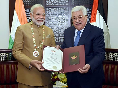 Prime Minister Narendra Modi receives the Grand Collar- the highest order given to foreign dignitaries by Palestinian President Mahmoud Abbas after the conclusion of their bilateral meeting in Ramallah on Saturday. | PTI