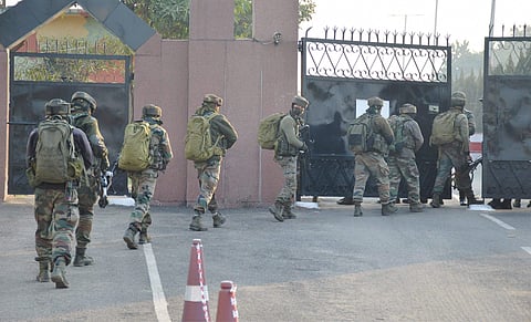 Security personnel take positions during a militants attack at Sunjwan Army camp in Jammu on Saturday. | PTI