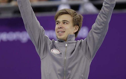 Semen Elistratov of the Olympic Athletes of Russia waves on the podium during a Venue Ceremony after his third place finish in the men's 1500 meters short-track speedskating final in the Gangneung Ice Arena. | AP