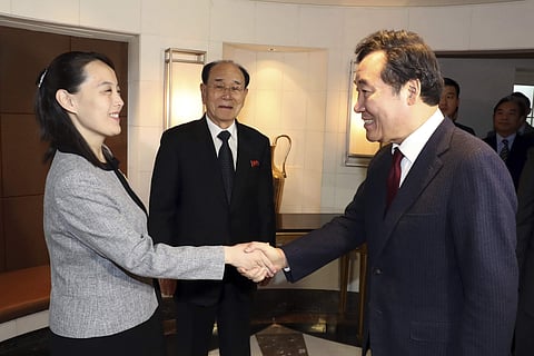 Kim Yo Jong (L) shakes hands with South Korean Prime Minister Lee Nak-yeon as Kim Yong Nam (C) North's nominal head of state watches | AP