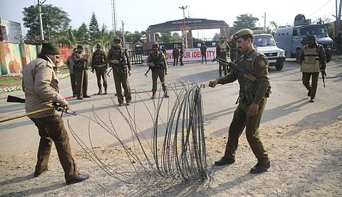 Security personnel place the barbed wires outside the Sunjwan Army camp in Jammu on Saturday. | PTI