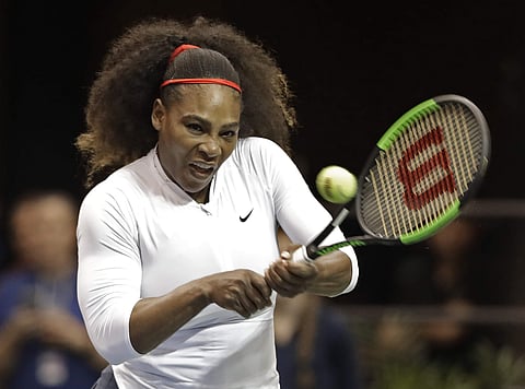 Serena Williams returns a shot against the Netherlands during a doubles match in the first round of Fed Cup tennis competition in Asheville. (AP)