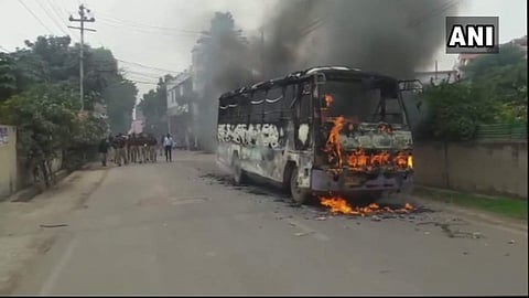 Bus torched by people in protest against death of an LLB student of Allahabad University (Twitter Photo: ANI)