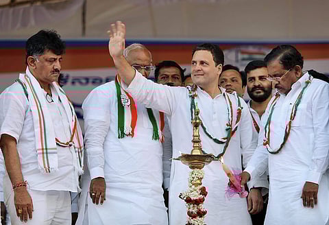 Congress President Rahul Gandhi waves at the public during a meeting. | PTI