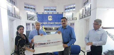 Shivashankar (2nd from left) hands over old photographs to A V Ramana, Dy Chairman, CPT (3rd from left)