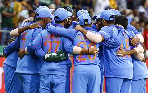 Indian cricket team members gather in a circle before the start of their fielding round during the fourth ODI cricket match between South Africa and India in Port Elizabeth, South Africa Tuesday, Feb. 13, 2018. | AP