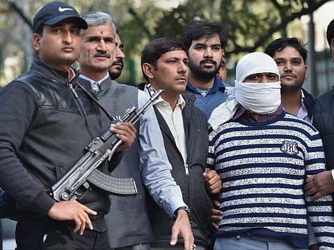Ariz Khan alias Junaid one of the most wanted Indian Mujahideen terrorist being taken to a court by Delhi Police Special Cell after his arrest in New Delhi on Wednesday. | PTI