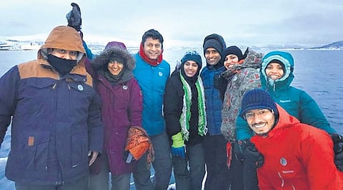 Alankar Chandra (in black mask) with travellers in Norway