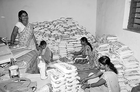 Workers engaged in packaging low-cost sanitary napkins at the production unit | Express