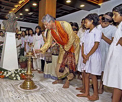 Vice-Chancellor of Visva Bharati University Susanta Dutta Gupta lights a lamp during a function to celebrate Gurudev's birth anniversary at Santiniketan in West Bengal. PTI