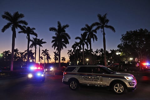 File photo of law enforcement vehicles arrive at a hotel where parents were instructed to pick up their children in Coral Springs. (AP)