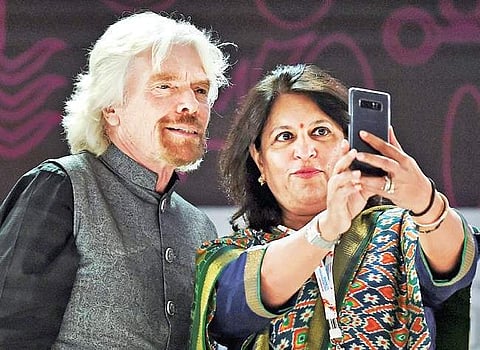 Apollo Group executive vice chairperson Shobana Kamineni (right) takes a selfie with Virgin chairman Richard Branson in Mumbai on Sunday | PTI